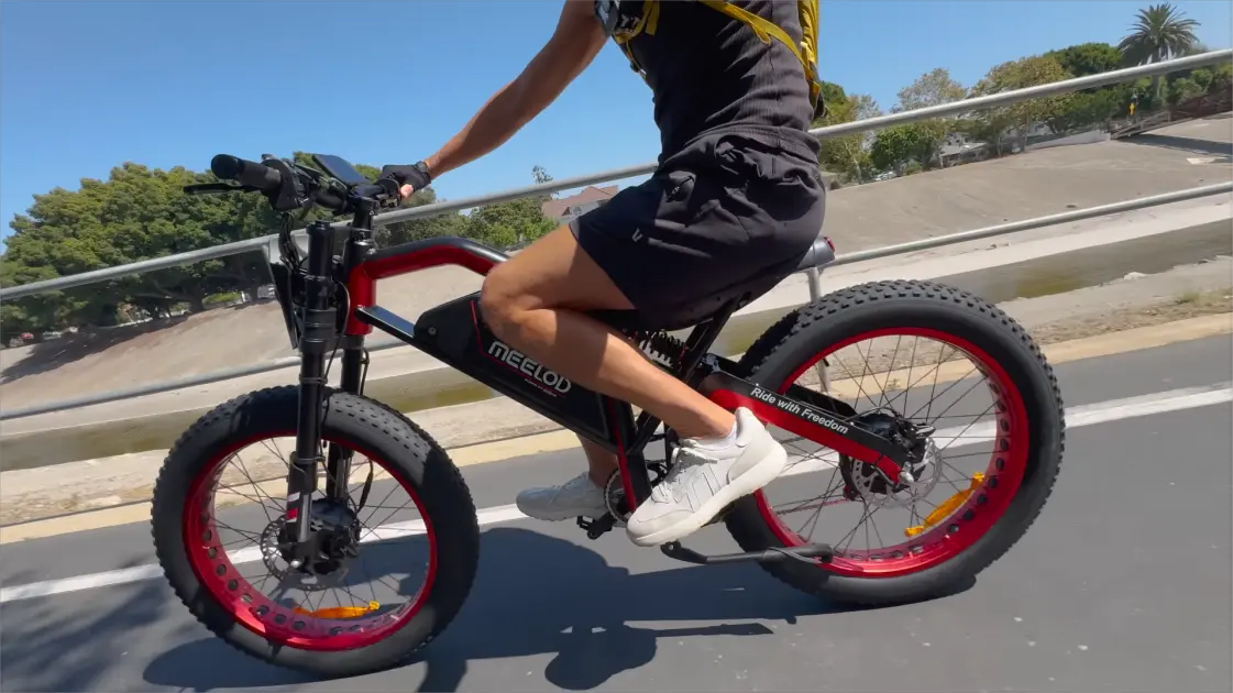 Ebike rider balancing speed and battery efficiency