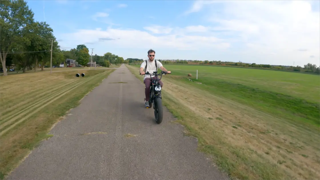 rider checking ebike battery before long-distance trip