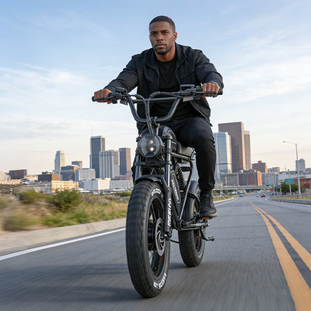 Man riding a Meelod moped style electric bike on a city road