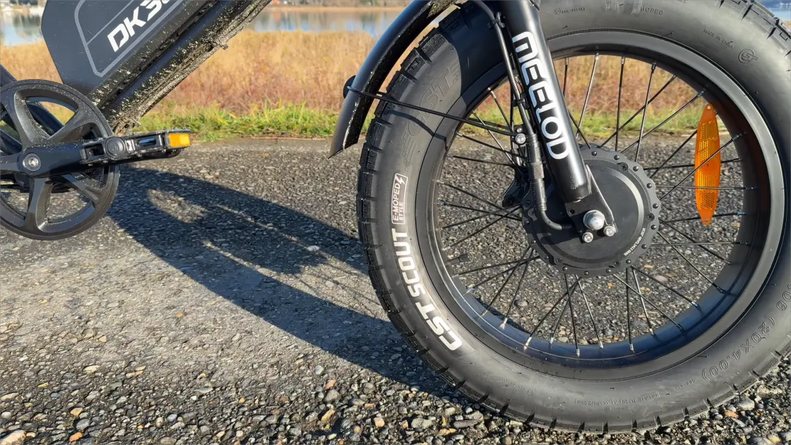 Fat tire e-bike riding on sandy terrain with wide tires