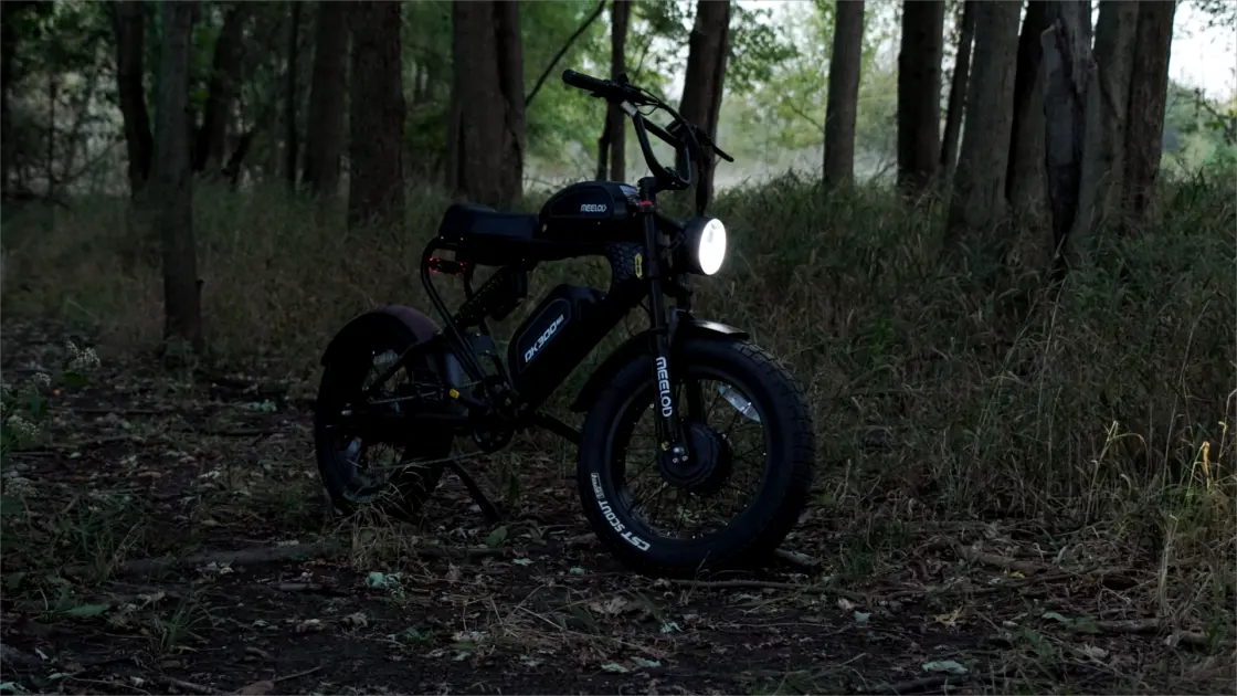 Fat tire e-bike riding through a forest trail