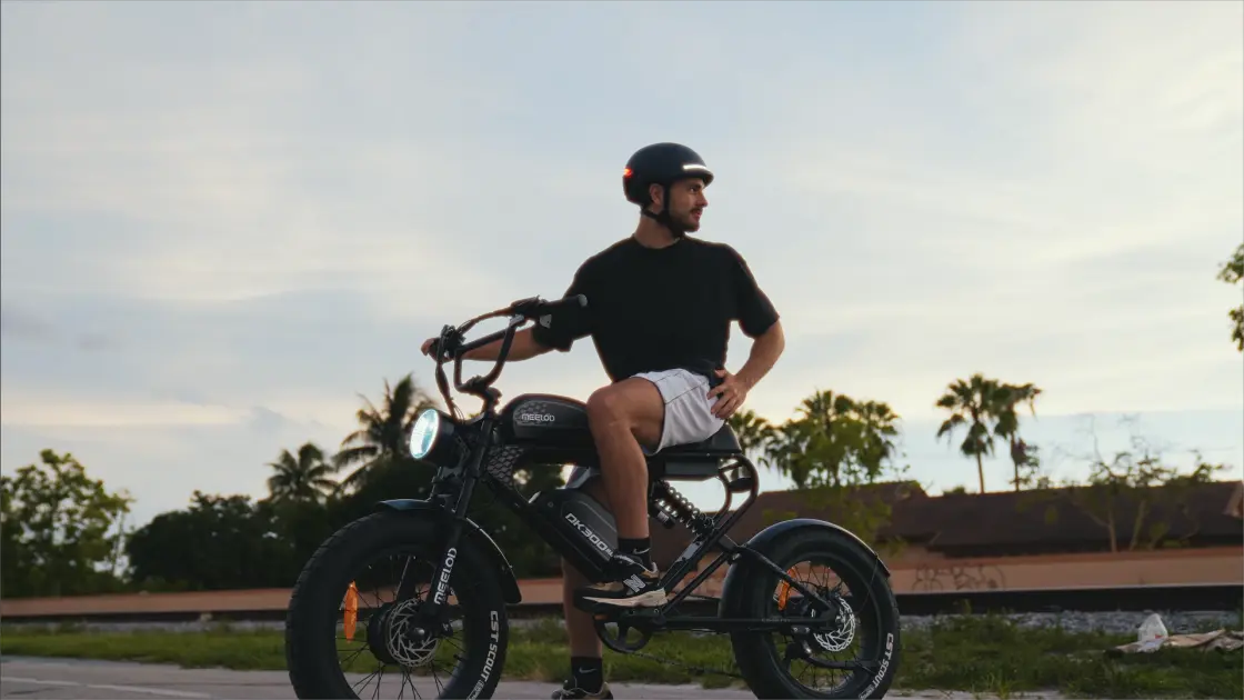 Rider riding a long-range electric bike looking back at the scenery