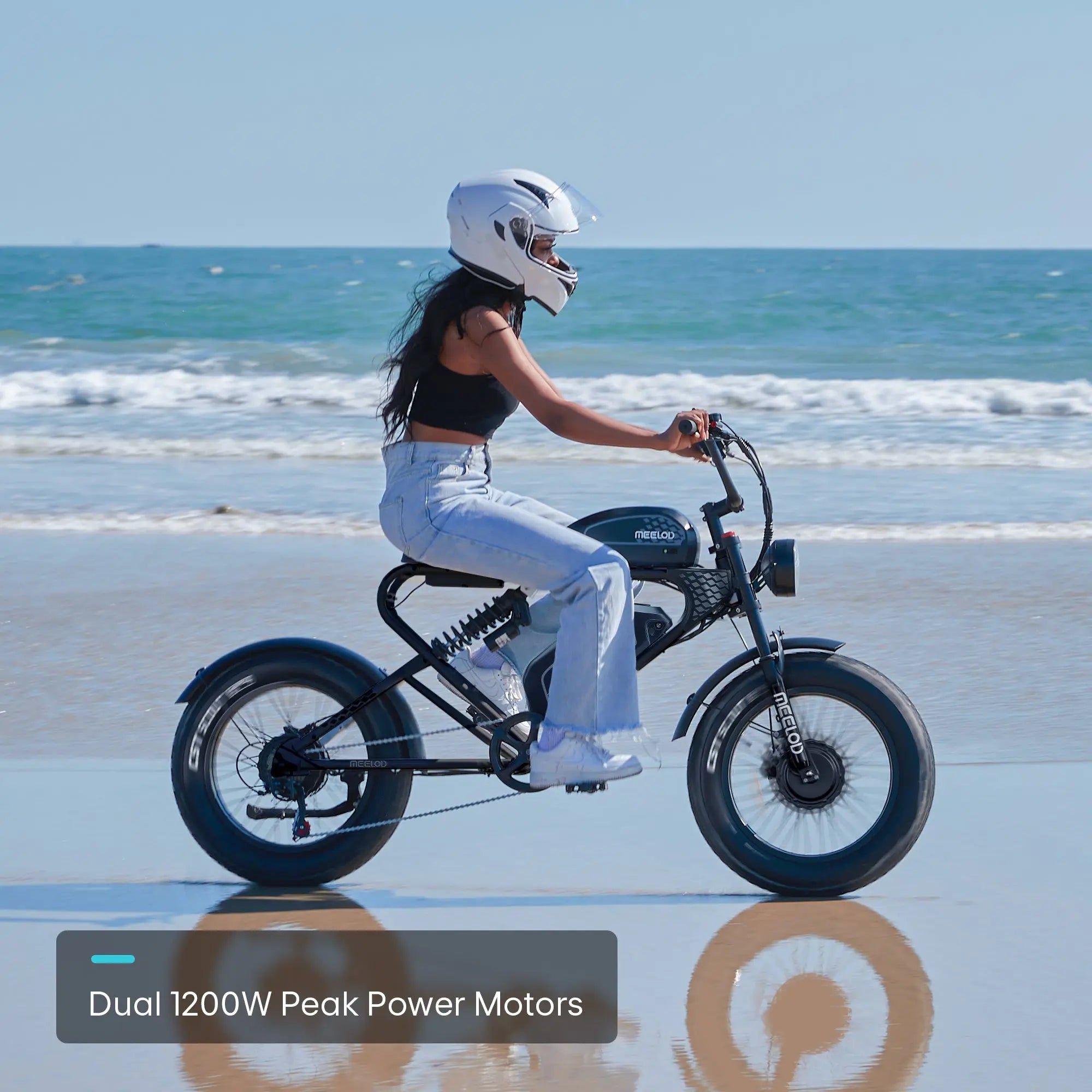 A woman wearing a helmet riding a Meelod long-range electric bike along the coast
